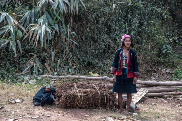 A woman and her crops wait for the bus