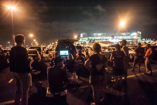 Those who couldn't afford the $900-$1750 ticket watched from the stadium parking lot