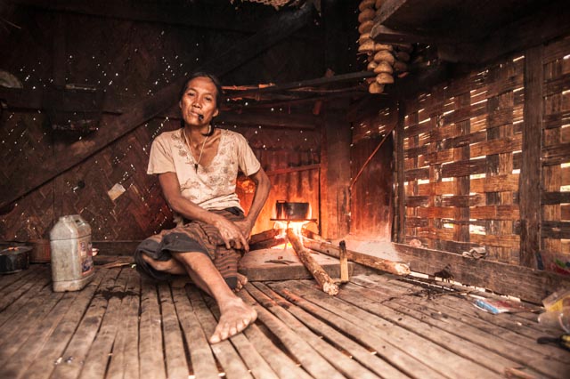 Reaching for a lighter, this woman was enjoying a morning smoke while making tea