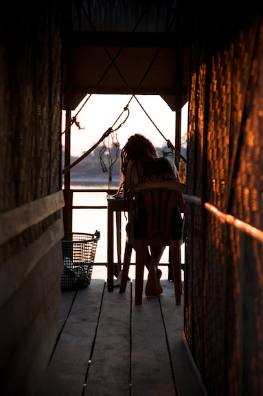 A tourist enjoys the quietness of a bungalow