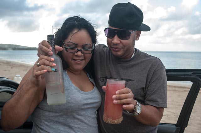 A Puerto Rican couple pauses for a portrait as they relax along the beach near Luquillo