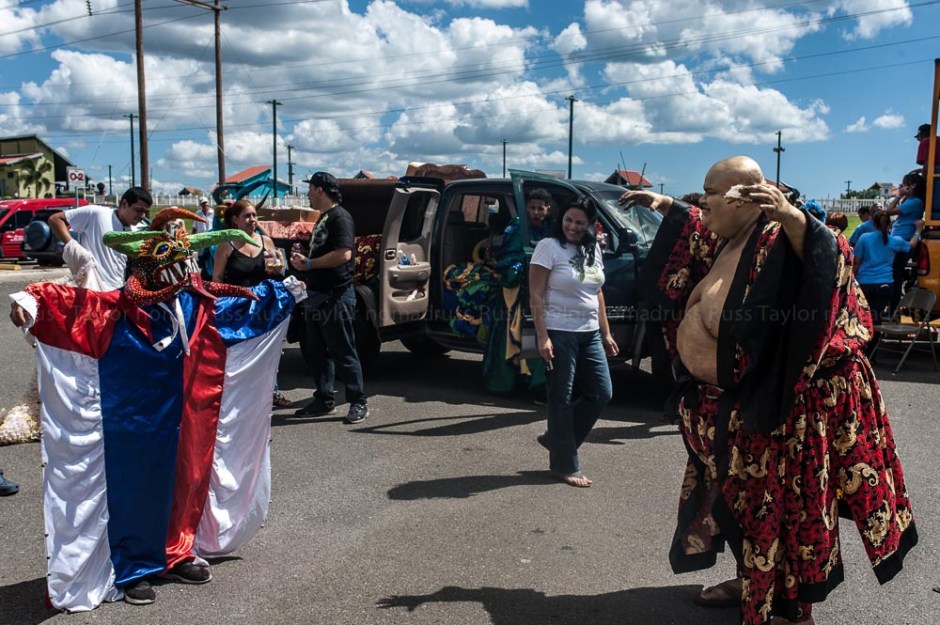 Teaching the young boy how to scare away evil spirits